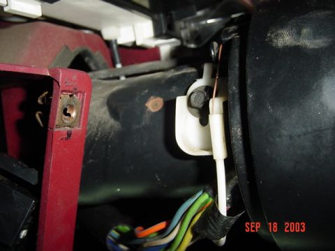 1989 Ford Bronco - A close-up view of the wiring harness and ignition components within a vehicle's interior.