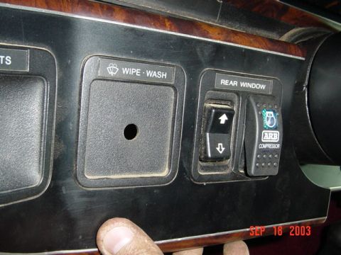 1989 Ford Bronco - Dashboard interior shows switches for wipe-wash, rear window, and an ARB compressor, with a date stamp of SEP 18 2003.