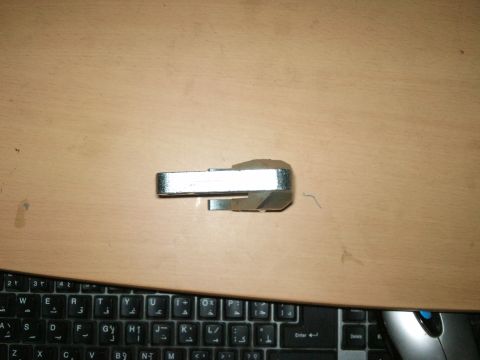 1998 Ford Crown Victoria - A valve spring compressor tool is shown on a wooden surface, with a keyboard visible at the bottom.