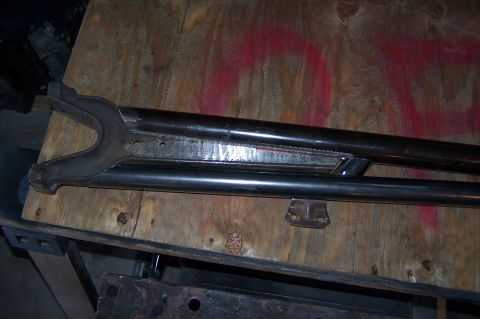 2000 Ford F-150 - Custom suspension part shown on a workbench, likely for off-road modification.