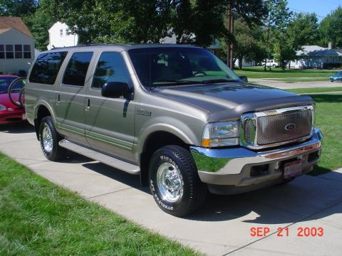 2002 Ford Excursion - Cleaned up with the Taurus in the background.