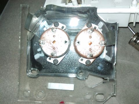 1998 Ford Crown Victoria - This is a close-up view of a disassembled vehicle instrument cluster, showing two gauge components.