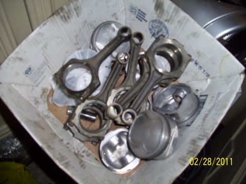 1995 Ford Probe - Engine parts are piled in a cardboard box, with a date stamp visible.