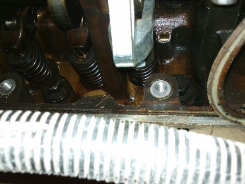 1998 Ford Crown Victoria - Close-up of an engine's valve train components, showing springs and rockers.