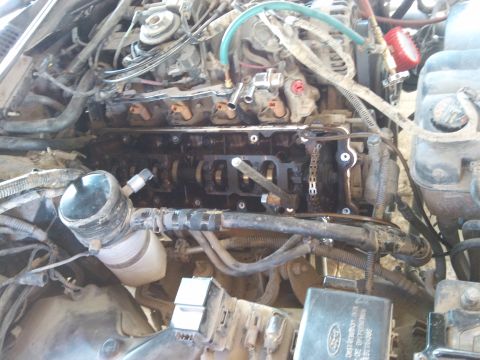 1998 Ford Crown Victoria - Engine internals exposed during valve seal replacement procedure.