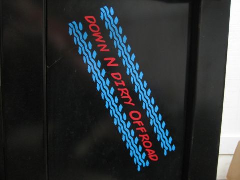 1995 Ford Bronco - A decal reads "DOWN N DIRTY OFFROAD" with blue tire tracks on a black surface.