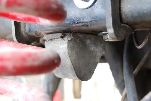 1982 Ford Bronco - Rubber body mount showing wear and tear, attached to a metal bracket. Supermotors.net logo is present.