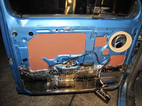 1993 Ford F-250 - Car door interior showing sound deadening installation and wiring.