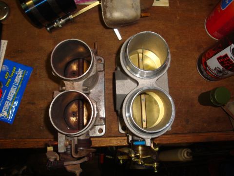 1989 Ford Bronco - Comparison of a used throttle body next to a clean, possibly rebuilt or new one.