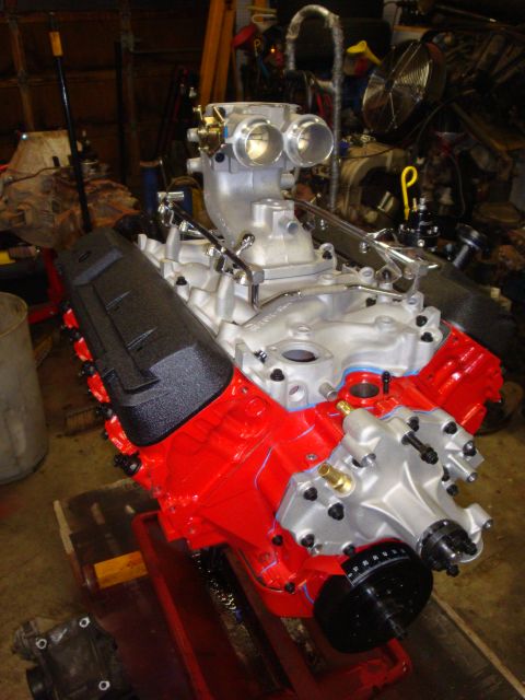 1989 Ford Bronco - Custom Ford V8 engine assembly with dual carburetors and red block paint.