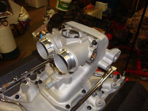 1989 Ford Bronco - Close-up of a Ford engine intake manifold, likely for a performance application, with visible "Ford" branding.