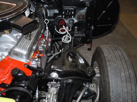1972 Chevrolet Camaro - Close-up view of the engine bay and front suspension assembly of a vintage vehicle.