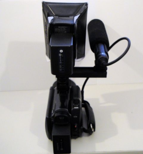 1993 Ford Taurus - A video camera is equipped with a directional microphone and a Sony brand LED light attachment.