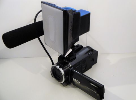 1993 Ford Taurus - A Sony Handycam camcorder is equipped with a microphone and an LED light panel.