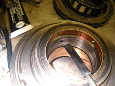 1993 Ford C-150 (Centurion Conversions) - Transmission component being lubricated with assembly lube during a rebuild.
