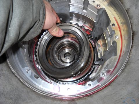 1993 Ford C-150 (Centurion Conversions) - Close-up of transmission internals, likely during a rebuild or inspection process.
