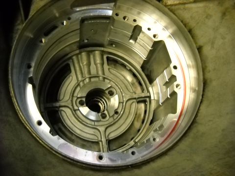 1993 Ford C-150 (Centurion Conversions) - Close-up of a disassembled transmission torque converter housing, showing internal components.