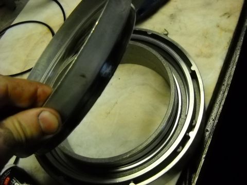 1993 Ford C-150 (Centurion Conversions) - Close-up of a metal transmission component, likely for an E4OD rebuild.