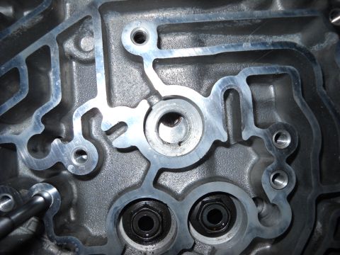 1993 Ford C-150 (Centurion Conversions) - Detailed view of a transmission valve body, showing intricate internal passages and fasteners.
