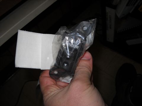1993 Ford C-150 (Centurion Conversions) - A new rear window switch is shown in its original packaging, ready for installation.