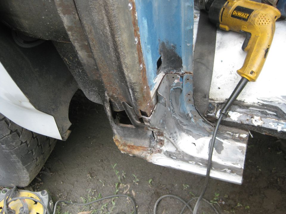 This is where I started my 2009-2010 body repairs.  as you can see I had already cut out most of the rocker panel on the right side before I started taking pictures.  What you see here is an old quick and dirty reconstruction to give the body panel a place to attach.  This time it is coming out and the lower B post will be repaired with the proper pieces.  also seen is a cut in the quarter panel that was necessary to get at this area.  Not to worry, because the plan all along was to replace the quarter panel too since it had the lower 4 inches replaced in the previous round of body repairs.