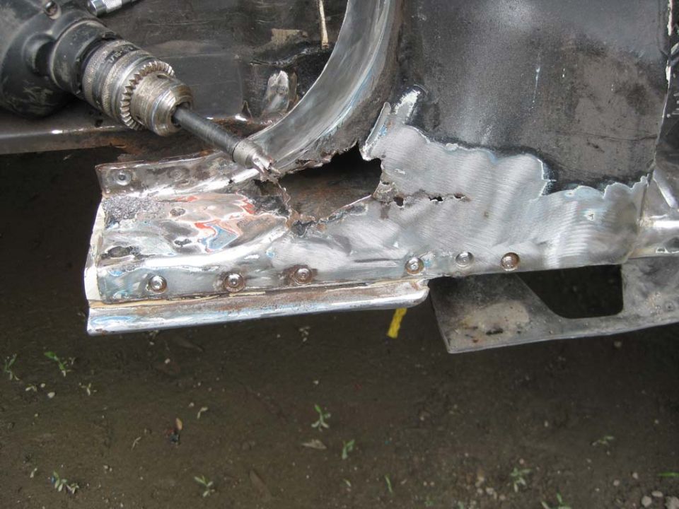 Here you see some rot in the A-post.  It has been there since I originally bought this truck and I have been able to keep it from progressing.  However, I think it is time to repair it permanently.
You can also see the welds that were cut using the weld cutter bit in the drill.