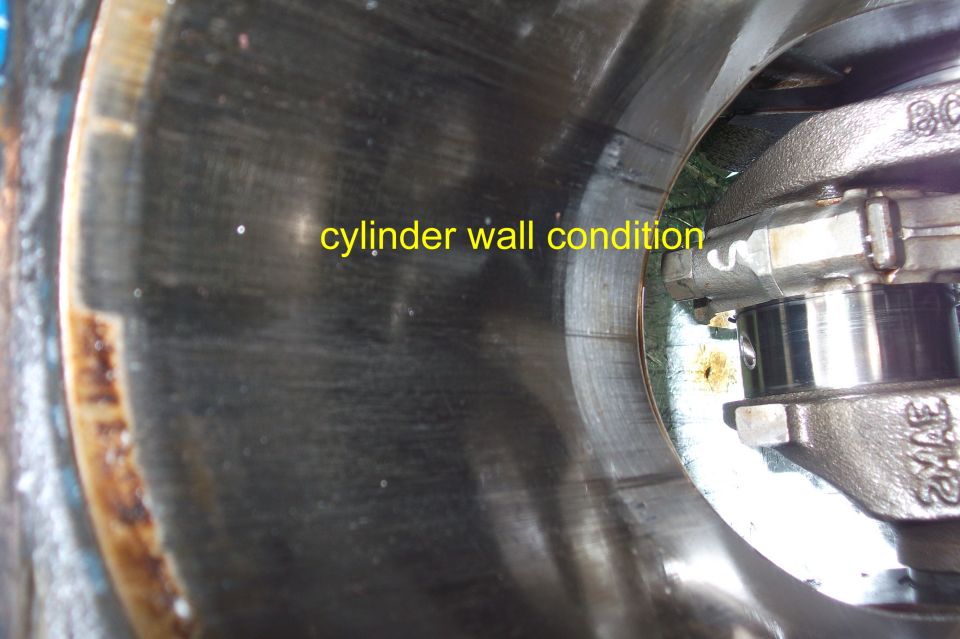 Engine cylinder wall with visible scoring and text overlay 'cylinder wall condition'