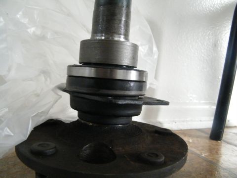 1982 Ford Bronco - Close-up of a wheel bearing and spindle assembly, likely a spare part.
