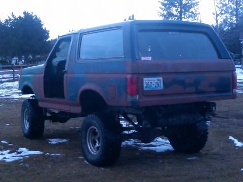 1988 Ford Bronco - This lifted Ford Bronco shows signs of custom modifications and a weathered exterior.