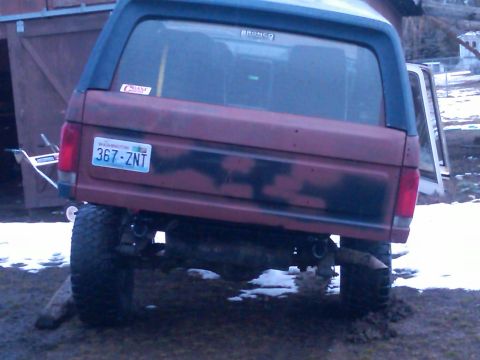 1988 Ford Bronco - Rear view of a 1988 Ford Bronco, showing its Washington license plate and camouflage paint.