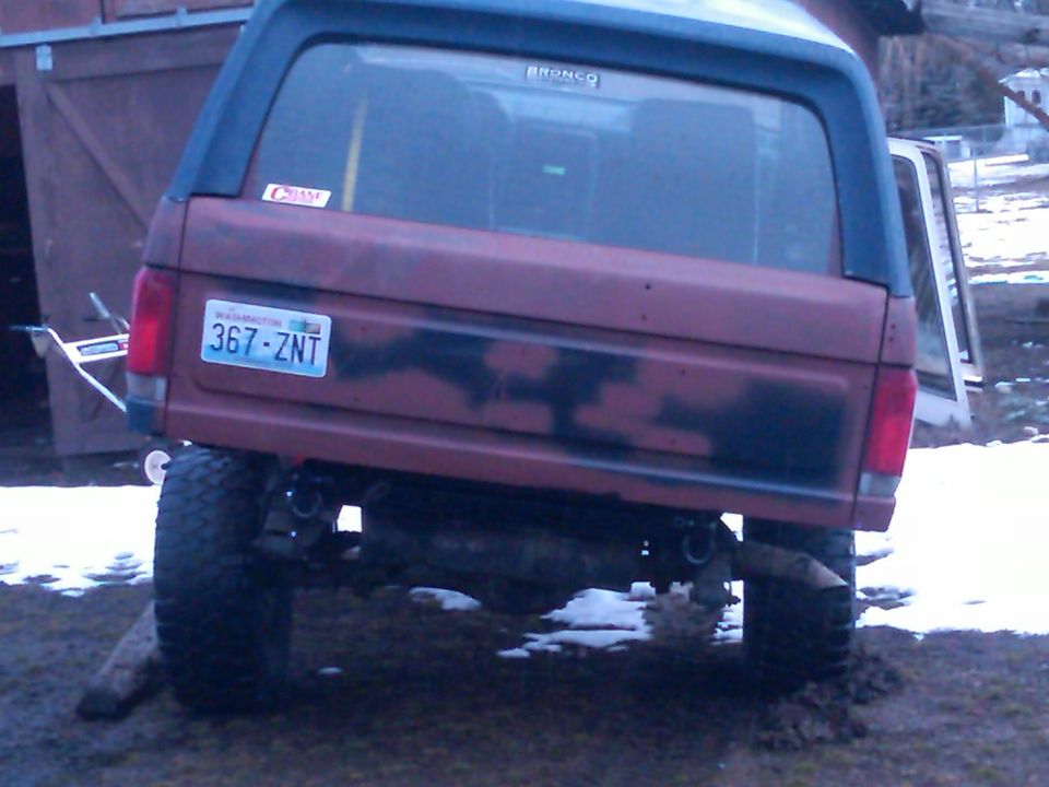 1988 Ford Bronco rear with Washington license plate 367-ZNT. Camouflage paint on tailgate
