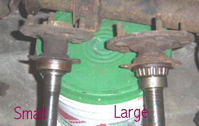 1982 Ford Bronco - Two rusty axle hubs and bearings are shown, with text indicating 'Small' and a website address.
