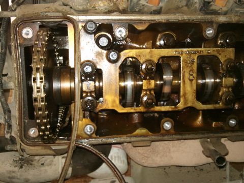 1998 Ford Crown Victoria - Close-up of an engine's internal components with the valve cover removed.