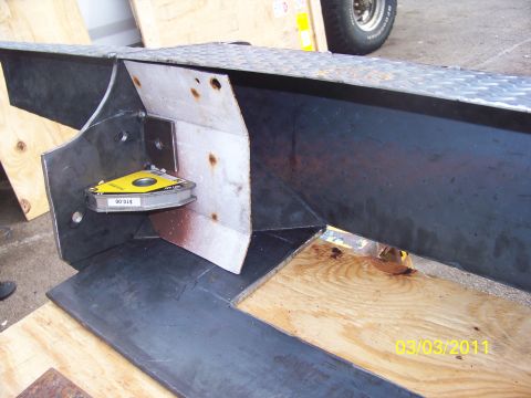 1989 Ford Bronco - Close-up of metal fabrication work, a magnetic level and construction elements. The date 03/03/2011 is visible.