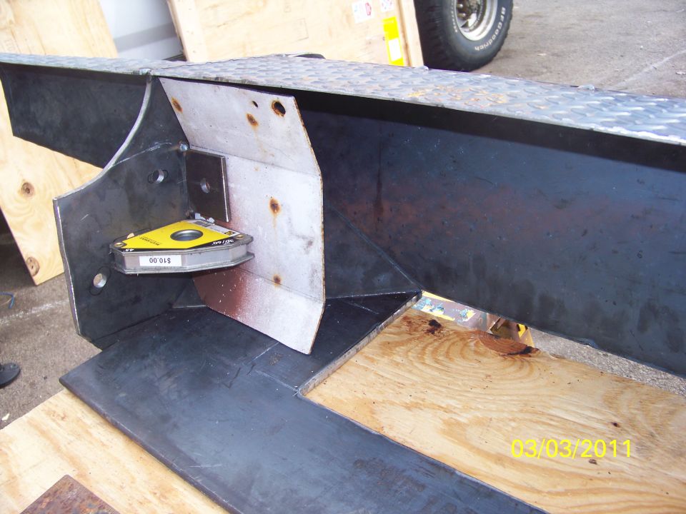 Metal fabrication with magnetic level attached, showing construction details
