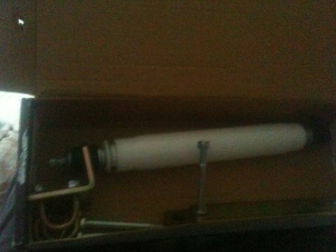 1993 Ford Bronco - A steering stabilizer shock absorber is shown inside a cardboard box.