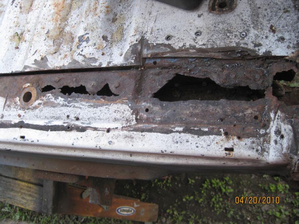 Now the damage to the tub  support cross member is evident.  That is only the tip of the ice burgh.  It is totally a loss and needs replacement.  You can't buy a replacement cross member.