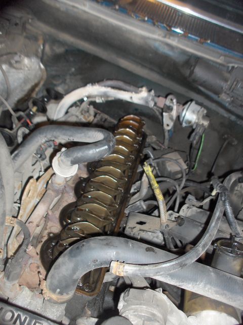 1994 Ford F-150 - The engine's valve train is exposed, showing internal components.