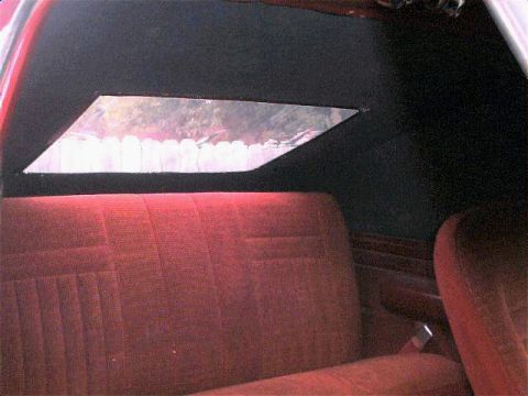 1990 Ford Bronco - Interior view of a vehicle's rear seating area with a skylight.