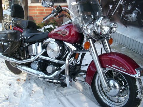 1999 Lincoln Town Car - 1999 Harley-Davidson Heritage Softail motorcycle in the snow. The album claims it is a Lincoln Town Car.