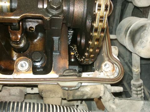 1998 Ford Crown Victoria - Engine internals are visible, including the timing chain and parts of the valve train.