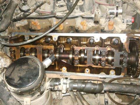 1998 Ford Crown Victoria - Close-up view of an engine's internal components, likely during a repair or maintenance procedure.