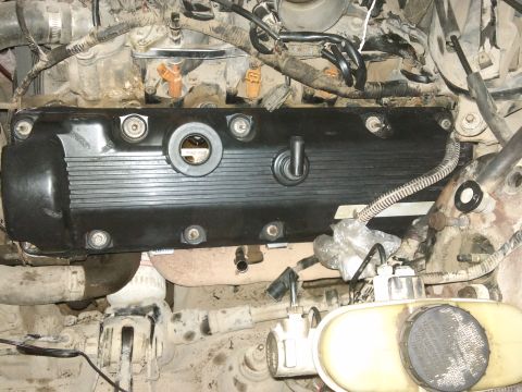 1998 Ford Crown Victoria - Engine valve cover and surrounding components, with a SuperMotors watermark.