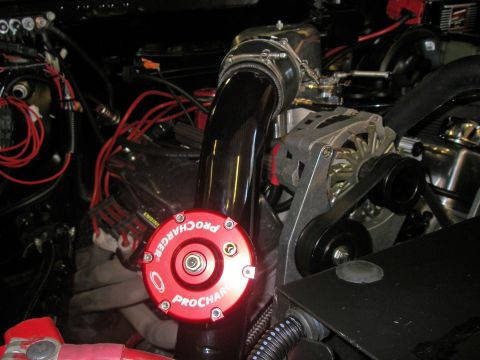 1990 Ford Bronco - Close-up of a ProCharger supercharger system installed in an engine bay.
