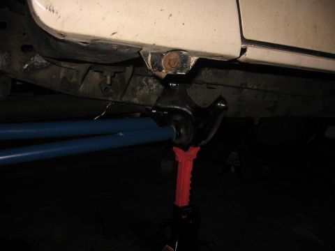 1993 Ford Bronco - Close-up view of a vehicle's underbody suspension system, showing modified components.