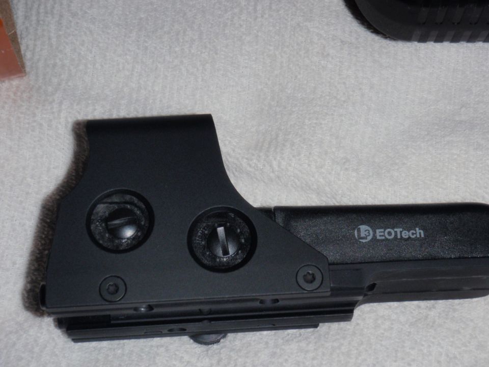 EOTech holographic sight with adjustment turrets visible and EOTech logo on the side