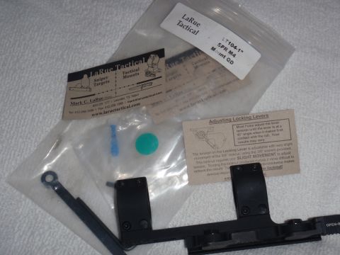 1991 Ford Bronco - A LaRue Tactical SPR M4 Mount QD is shown with its packaging, instructions, and small accessories.