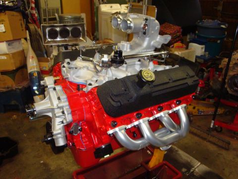 1989 Ford Bronco - Engine assembly with aftermarket performance parts, including a dual throttle body intake.