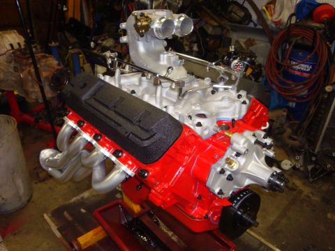 1989 Ford Bronco - A custom V8 engine assembly with performance upgrades is shown in a workshop setting.