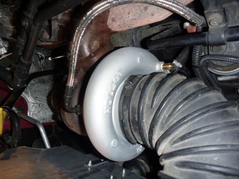 1997 Dodge 2500 - Close-up of a turbocharger and intake hose assembly, likely from an engine bay.